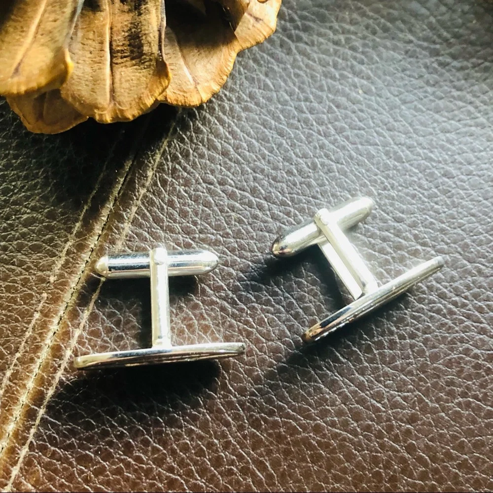 Vintage men’s Swank silver thin oval rope design cuff links